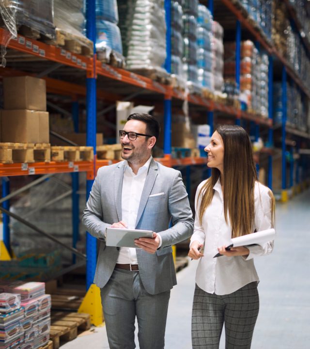 Two,Successful,Business,People,Walking,Through,Large,Warehouse,Center.,Manager Two,Successful,Business,People,Walking,Through,Large,Warehouse,Center.,Manager